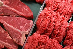 Raw steak and ground beef in a grocery store meat case