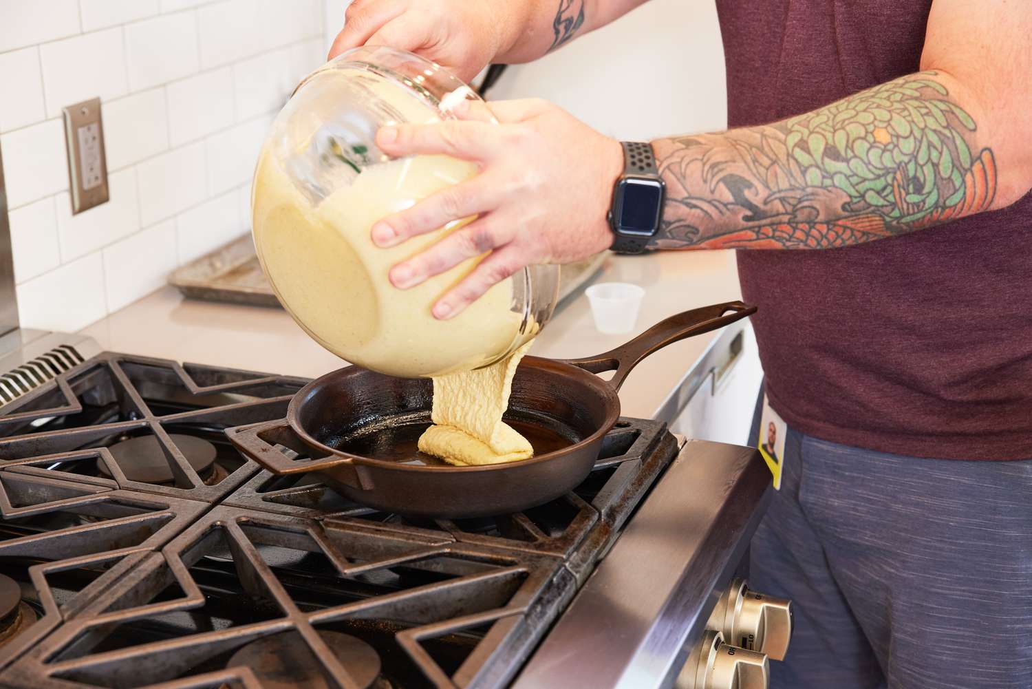 Person pouring batter into Stargazer 10.5-Inch Cast Iron Skillet