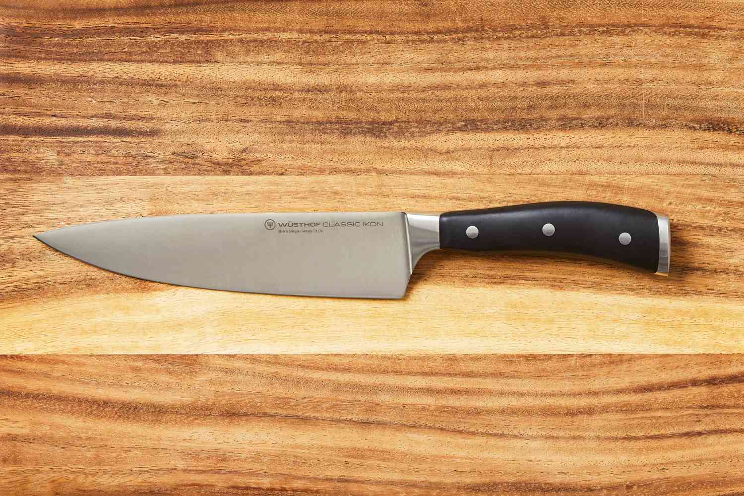 Wusthof 8-Inch Classic Chef's Knife on a wooden cutting board