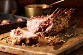 A rack of lamb on a cutting board