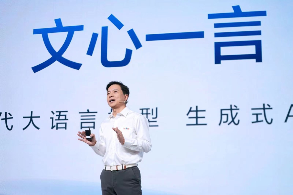 Baidu CEO Robin Li gives a speech about ERNIE Bot, the company's rival to ChatGPT, in front of a screen displaying its name in Chinese 'Wen Xin Yi Yan'