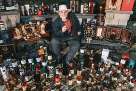 Mike Daley with his whiskey collection