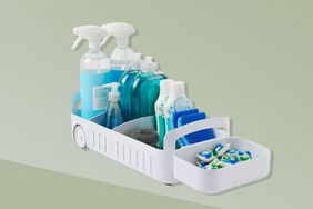 A bathroom organizer on a green background.