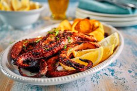 Grilled octopus served with beer