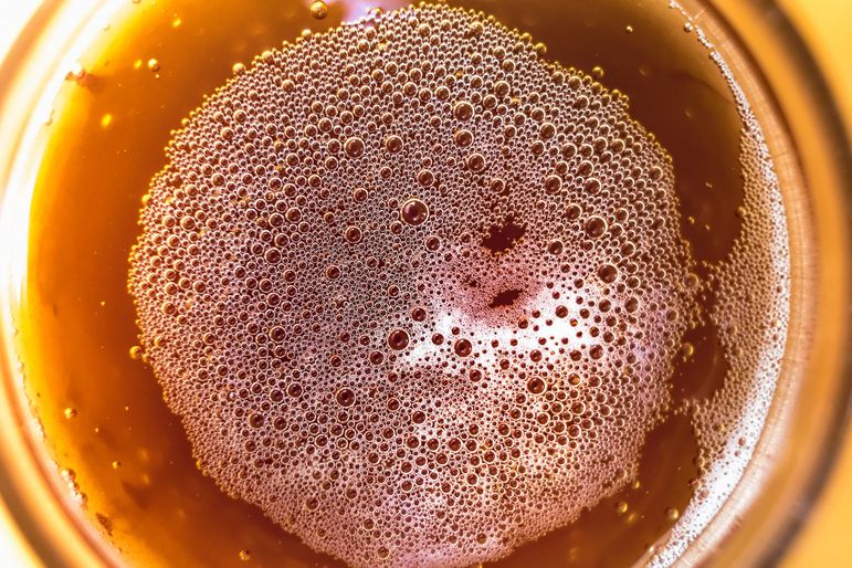 Overhead closeup of beer in a glass