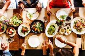 A group of people enjoying a meal at a restaurant